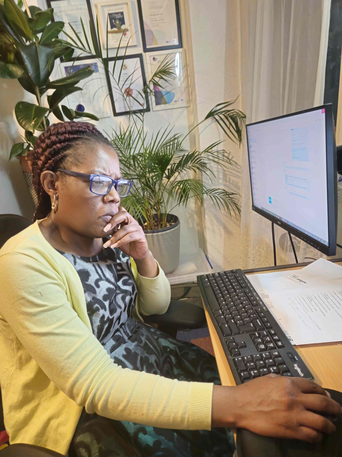 Dora Ngoma reviewing digital tax records on a computer as part of Making Tax Digital compliance.